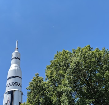 white concrete tower under blue sky during daytime