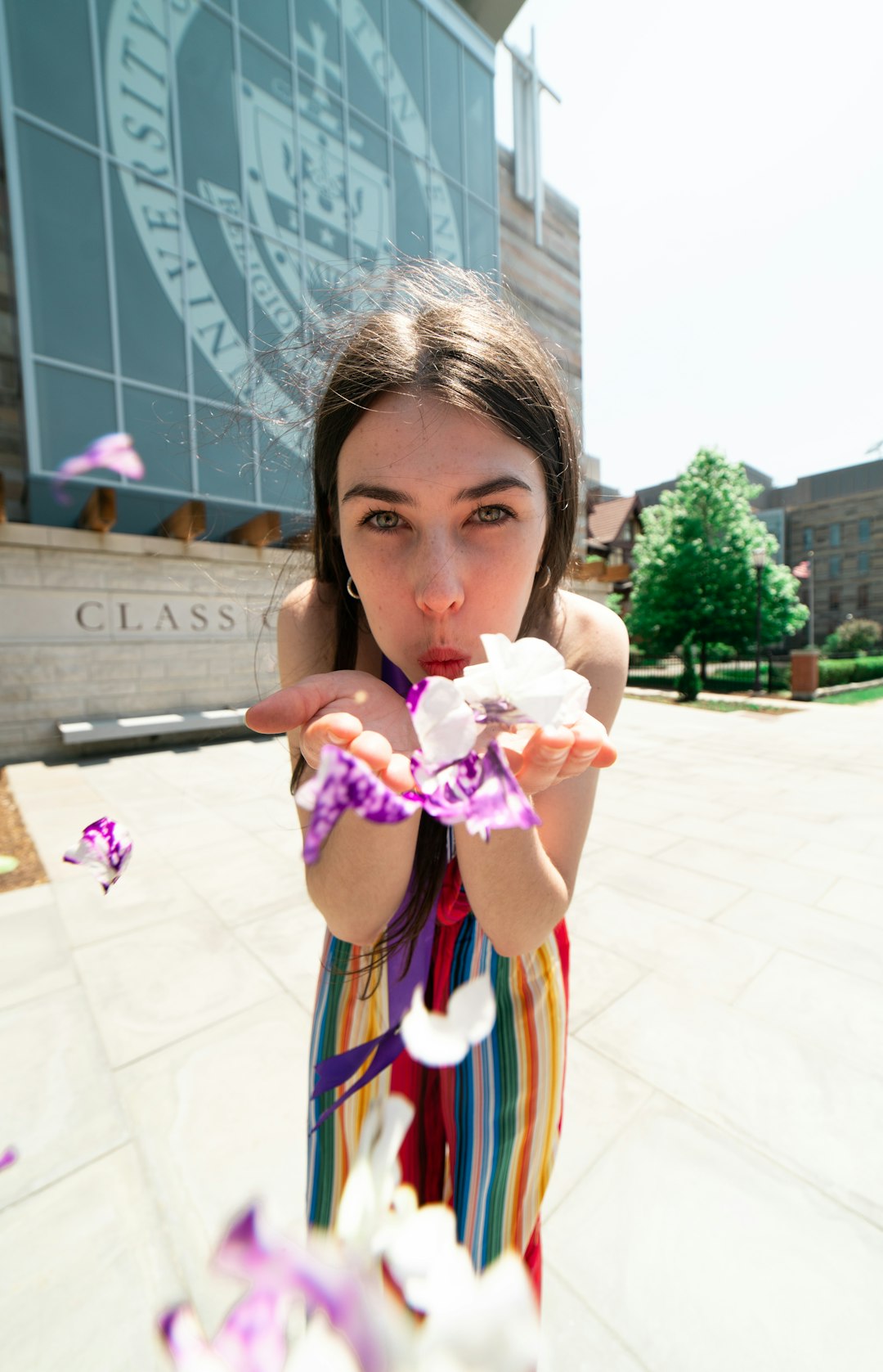 girl in pink and blue dress holding ice cream