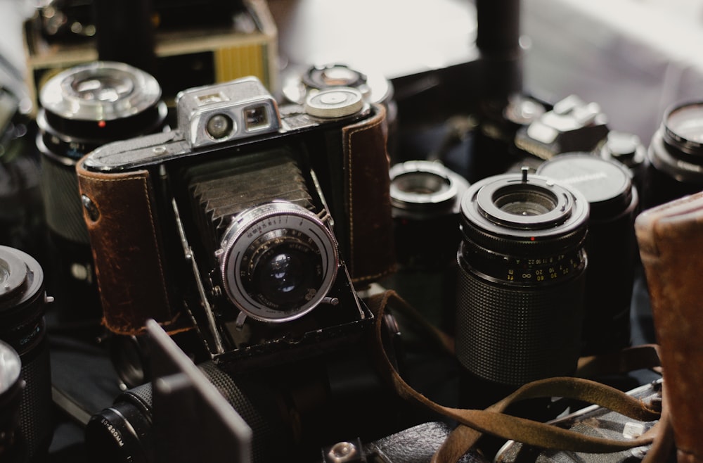 black and silver camera on brown wooden table