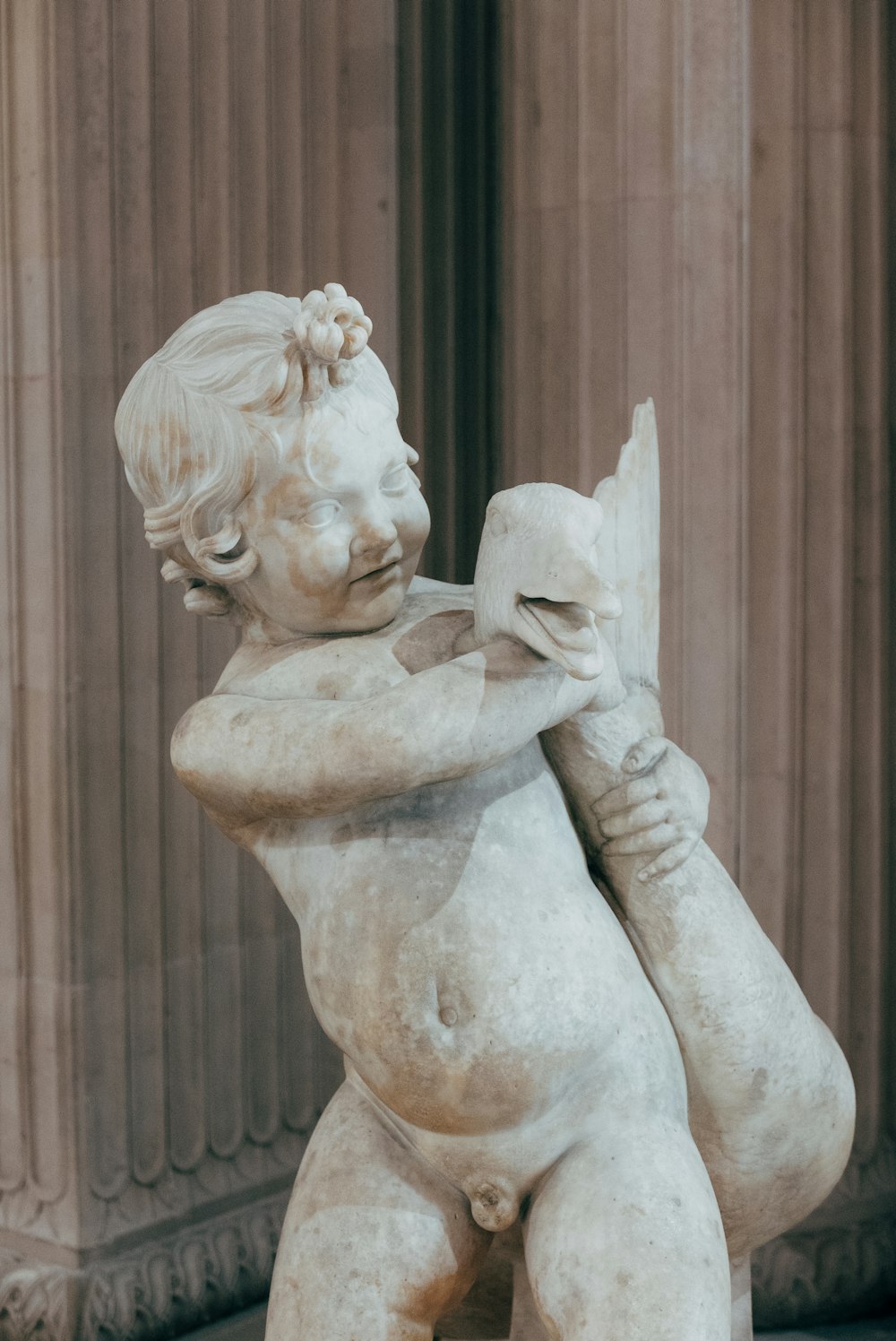 woman with white wings statue