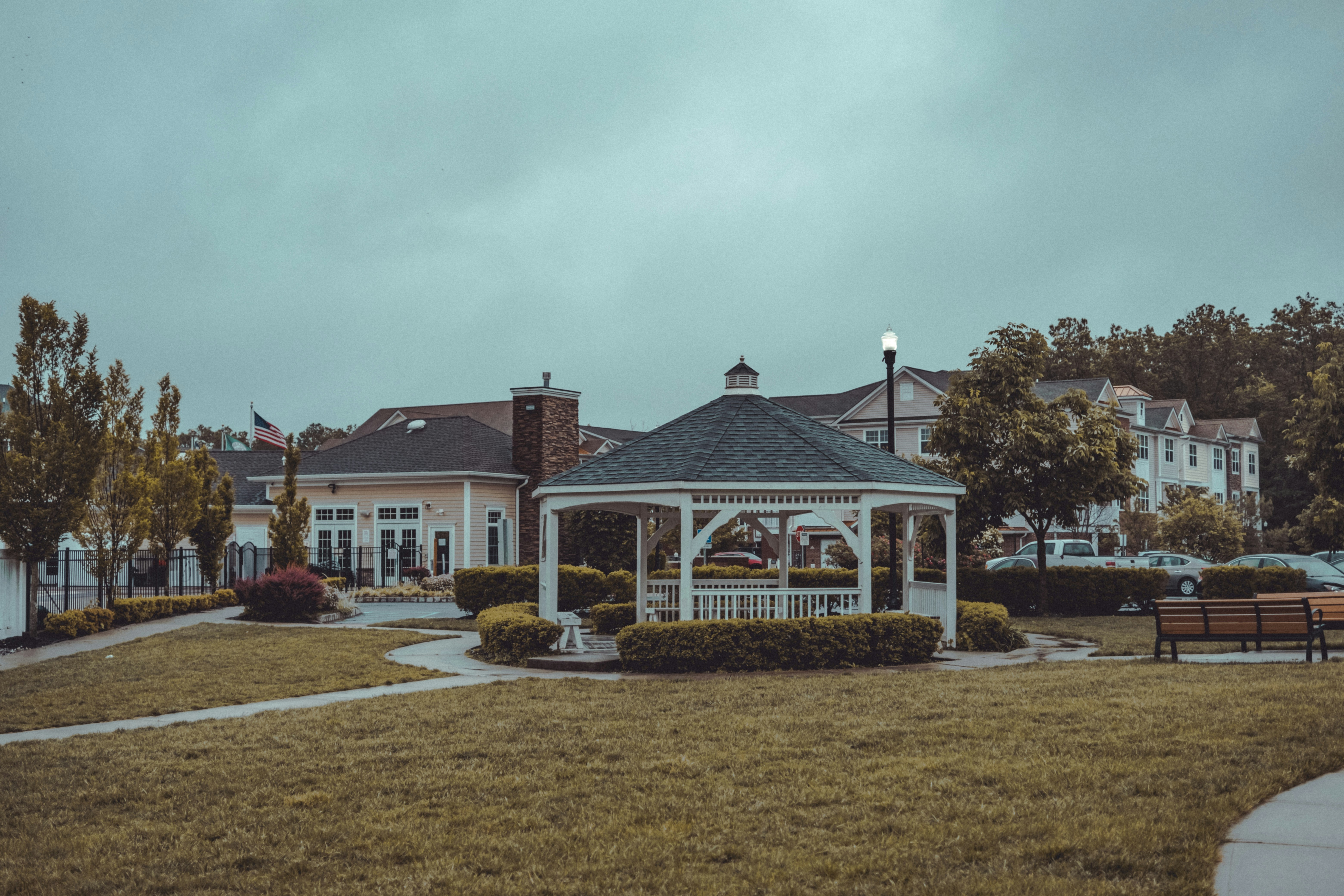 White and brown house near green grass field during daytime photo ...