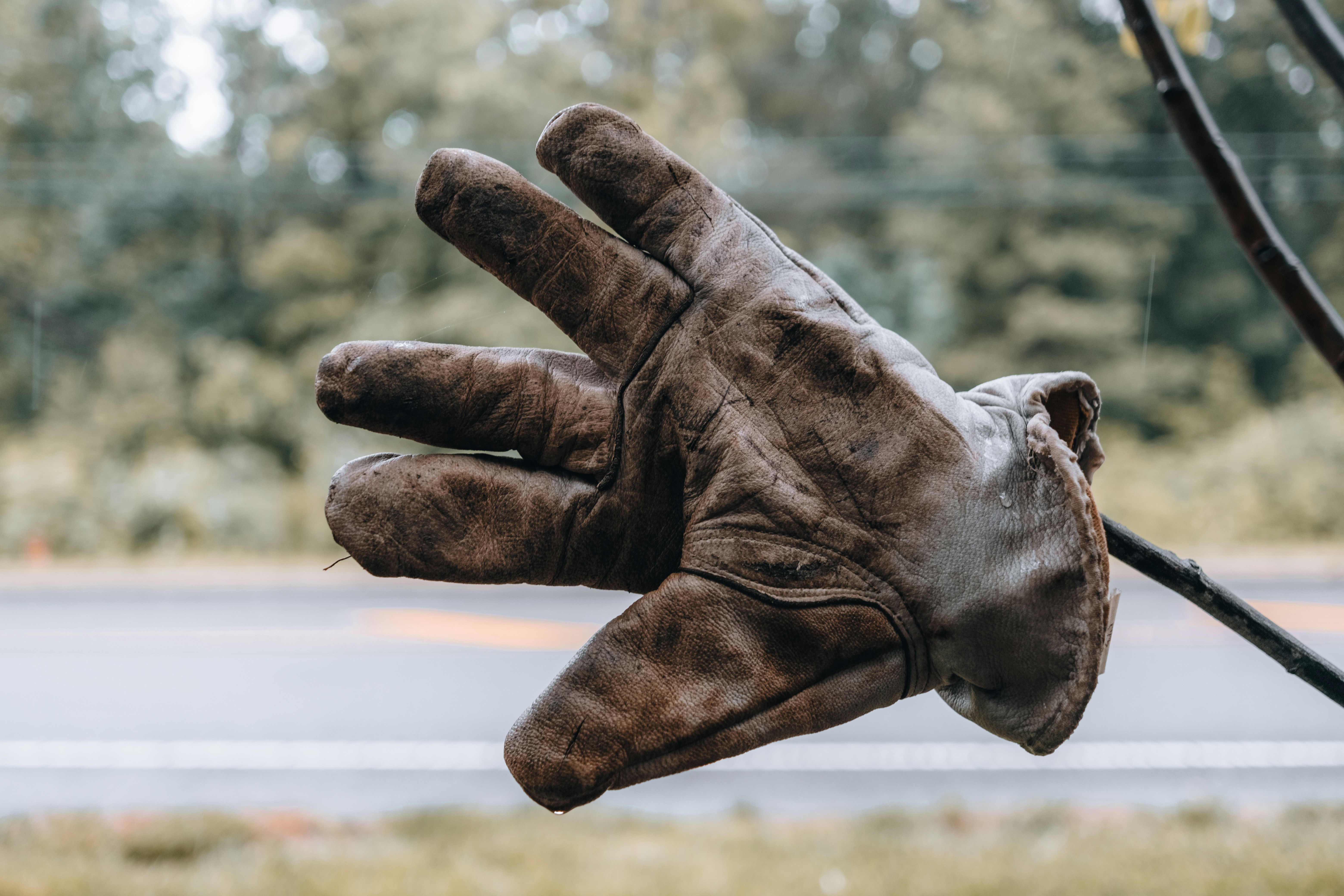 person wearing brown leather gloves
