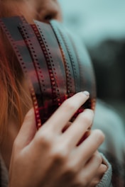 woman covering her face with her hand