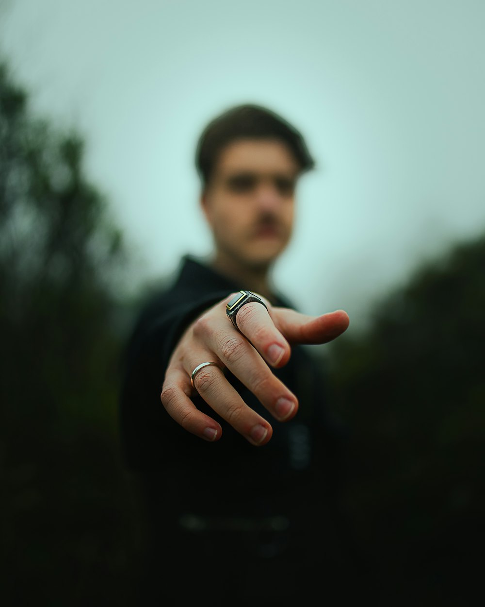 man in black shirt standing