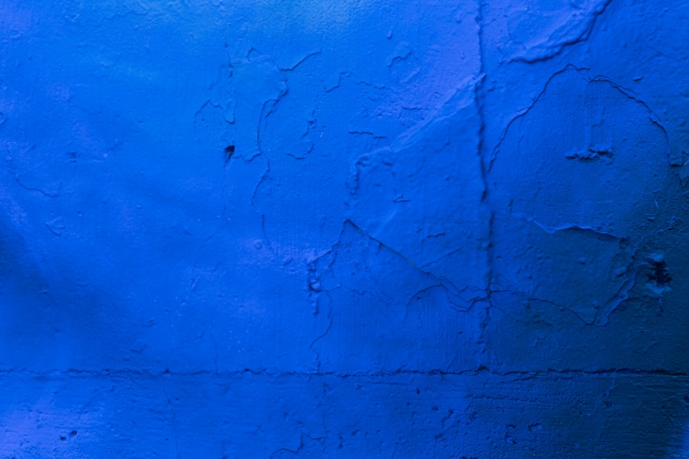 blue concrete wall with hole