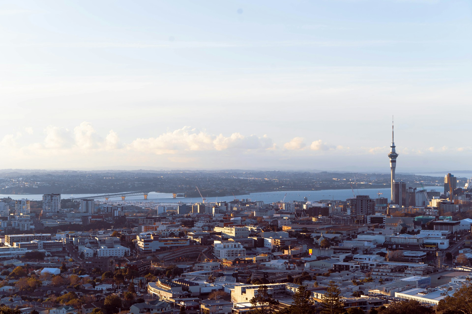 city skyline under white clouds during daytime