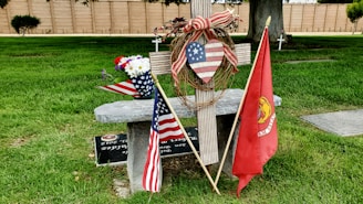A patriotic sticker featuring the American flag and a Christian cross.