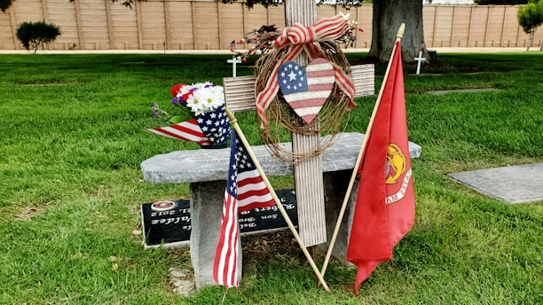 A patriotic sticker featuring the American flag and a Christian cross.