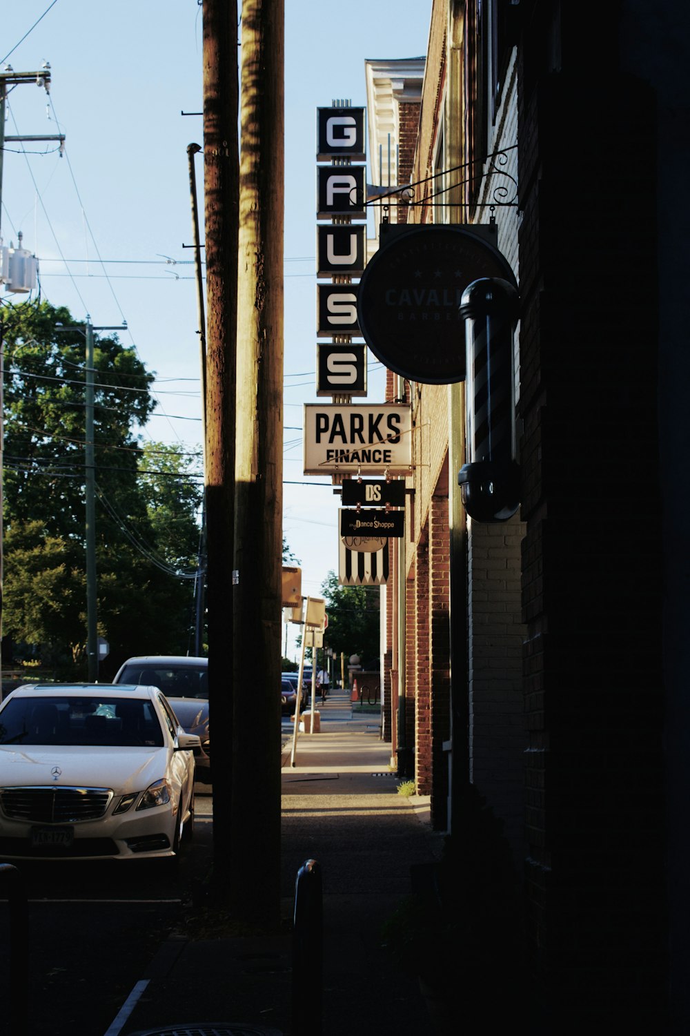 cars parked on side of the road during daytime