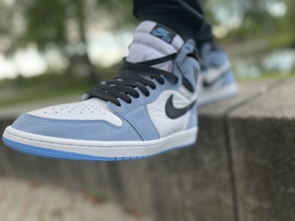 Close-up of a Nike running shoe with electric blue accents on a clean white background.