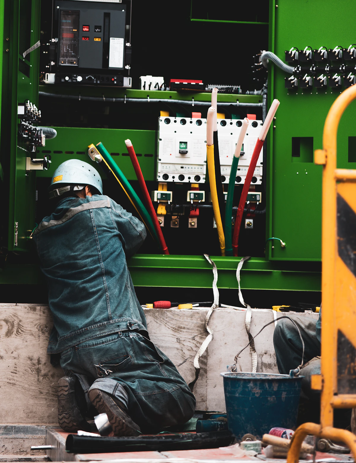Technician maintaining industrial equipment