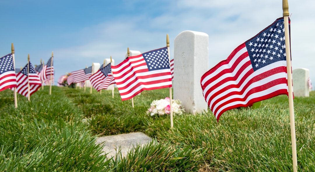 us a flag on green grass field