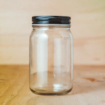 clear glass jar with white powder inside