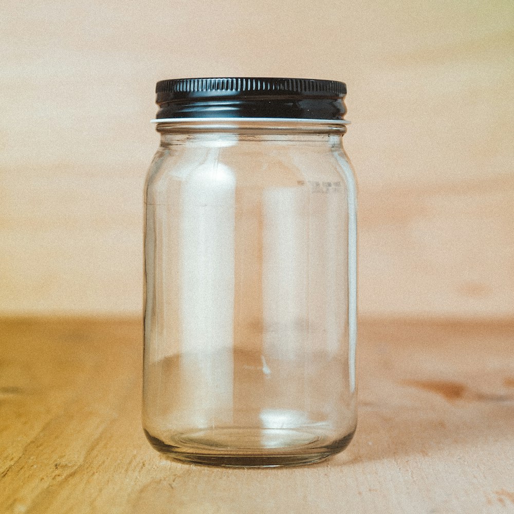 clear glass jar with white powder inside