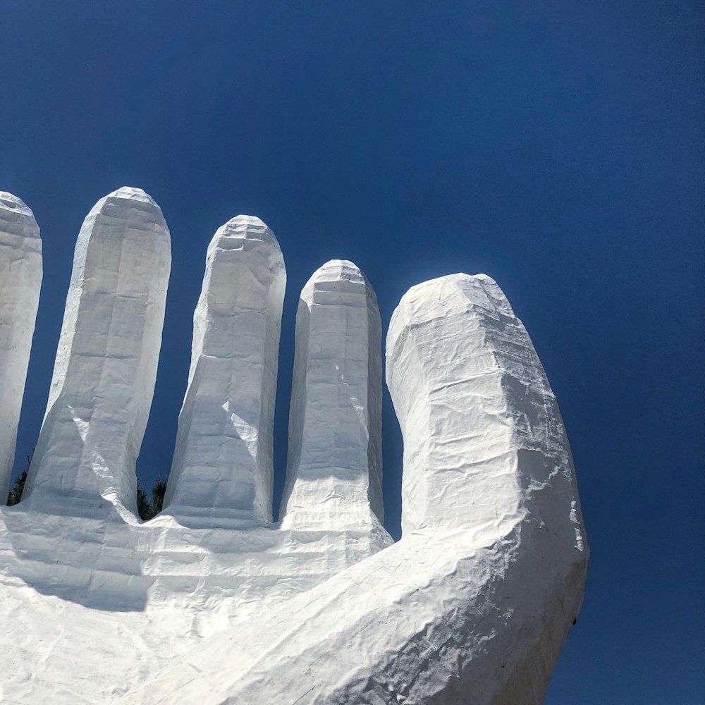 white ice blocks under blue sky during daytime