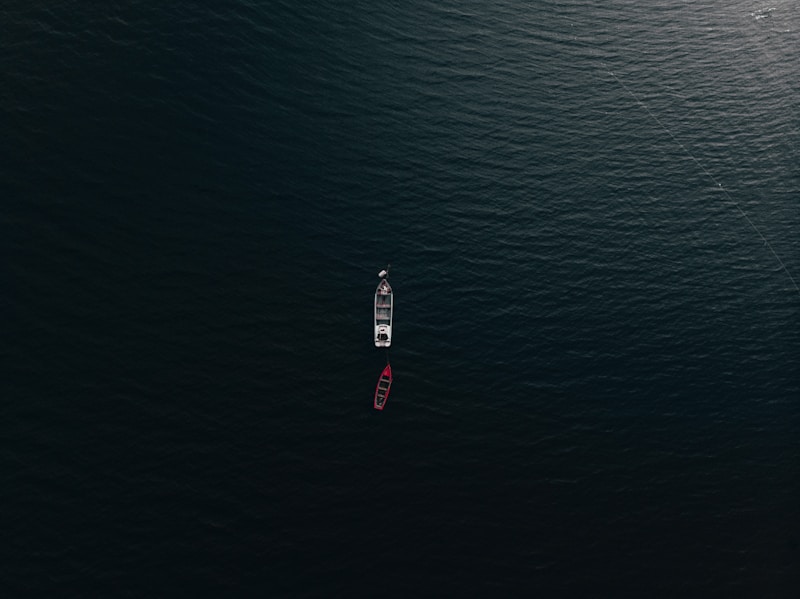 Red yacht on azure waters