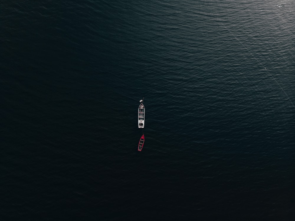 aerial view of red boat on sea during daytime