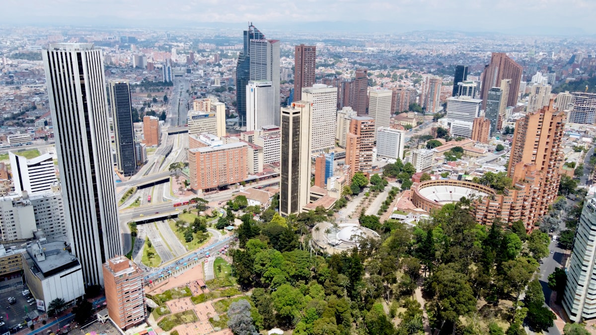 Zona Rosa Bogotá — the Parque de la 93 with restaurants and Bogotá skyline at dusk