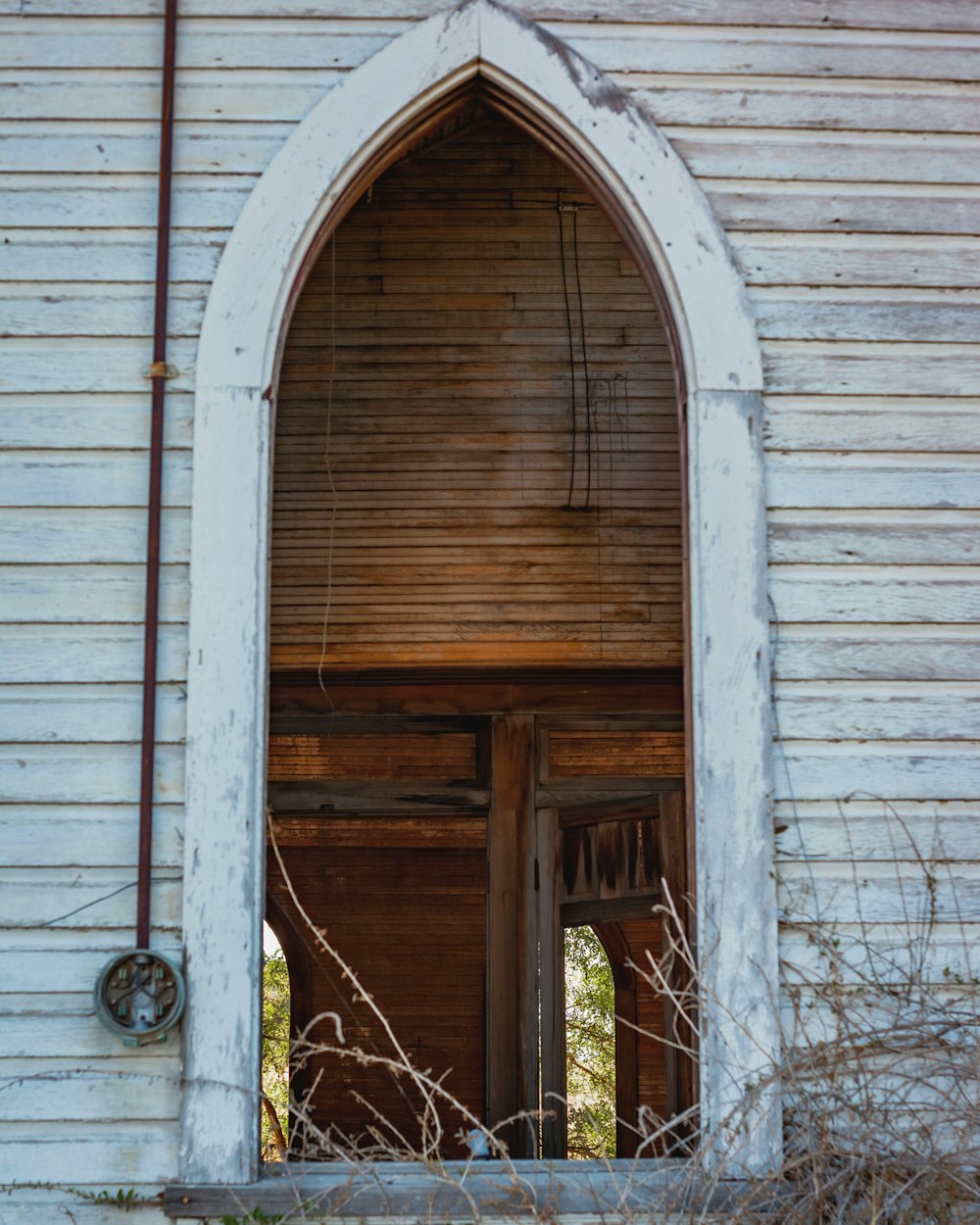 brown wooden door with white wooden frame