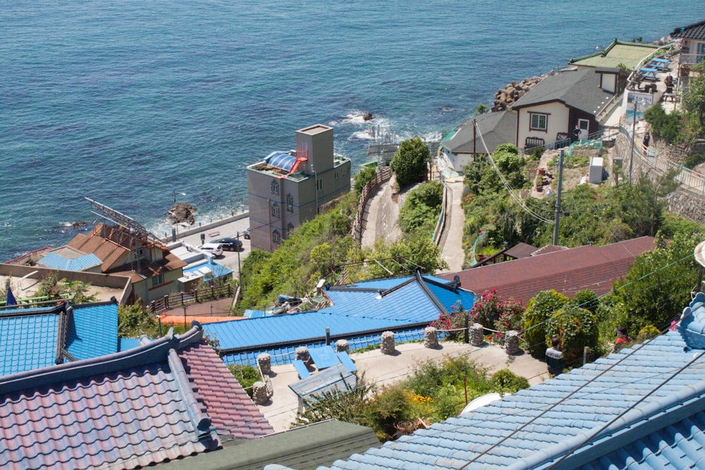 aerial view of houses near sea during daytime