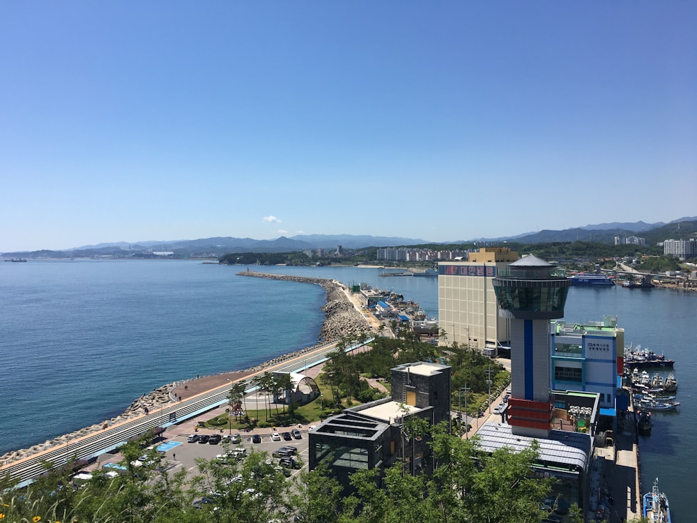 aerial view of city near body of water during daytime