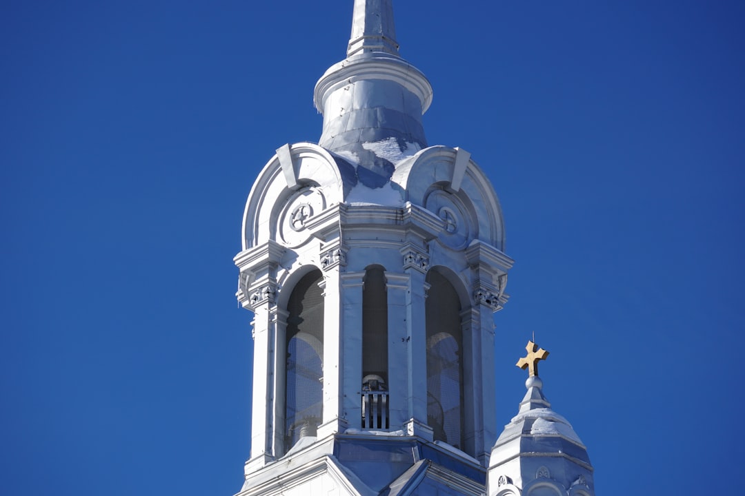 white and gray concrete church under blue sky during daytime