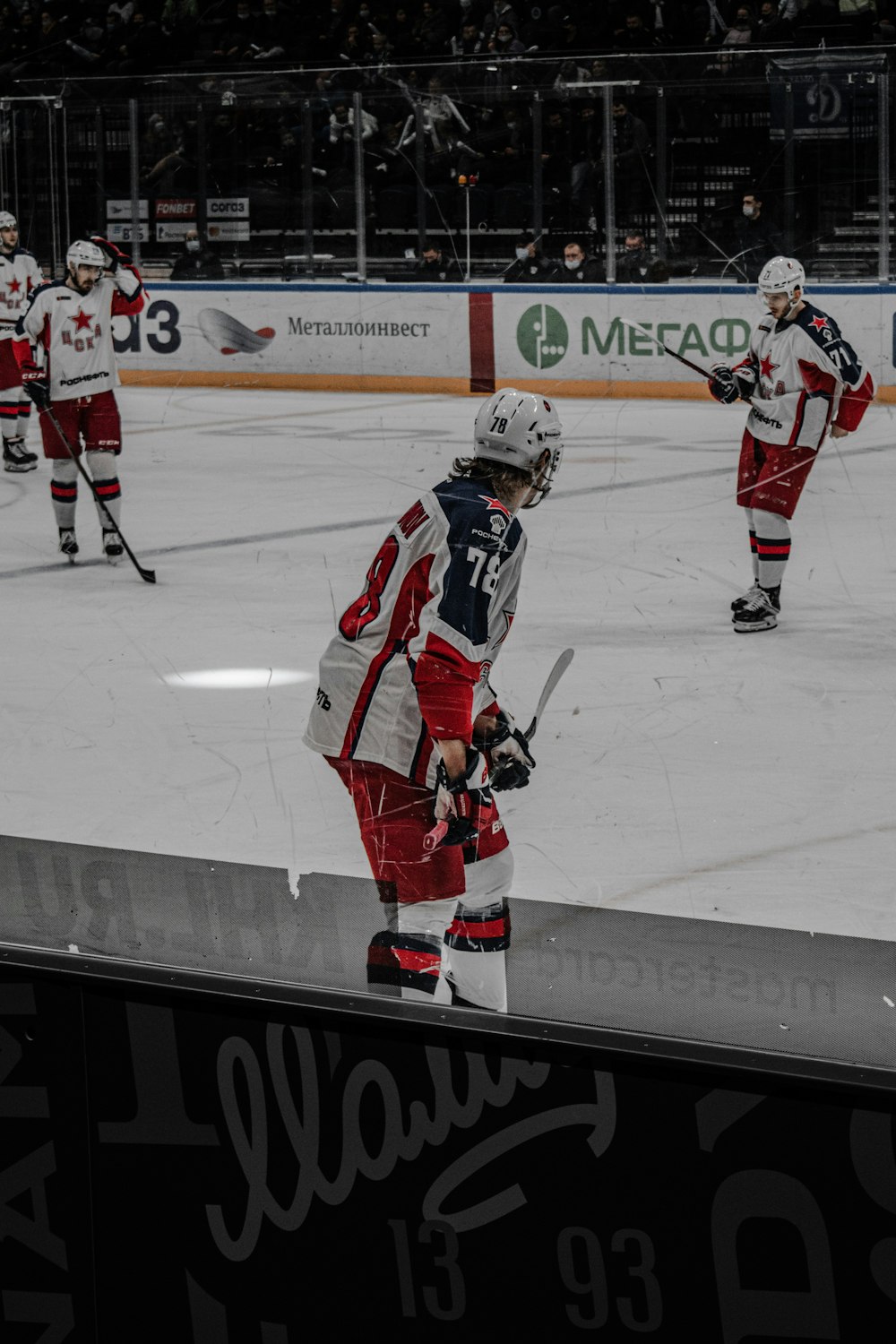 2 men playing ice hockey