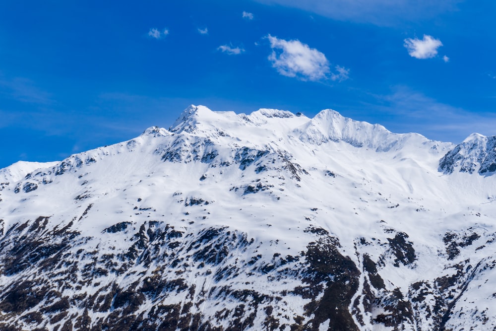 snow covered mountain under blue sky during daytime