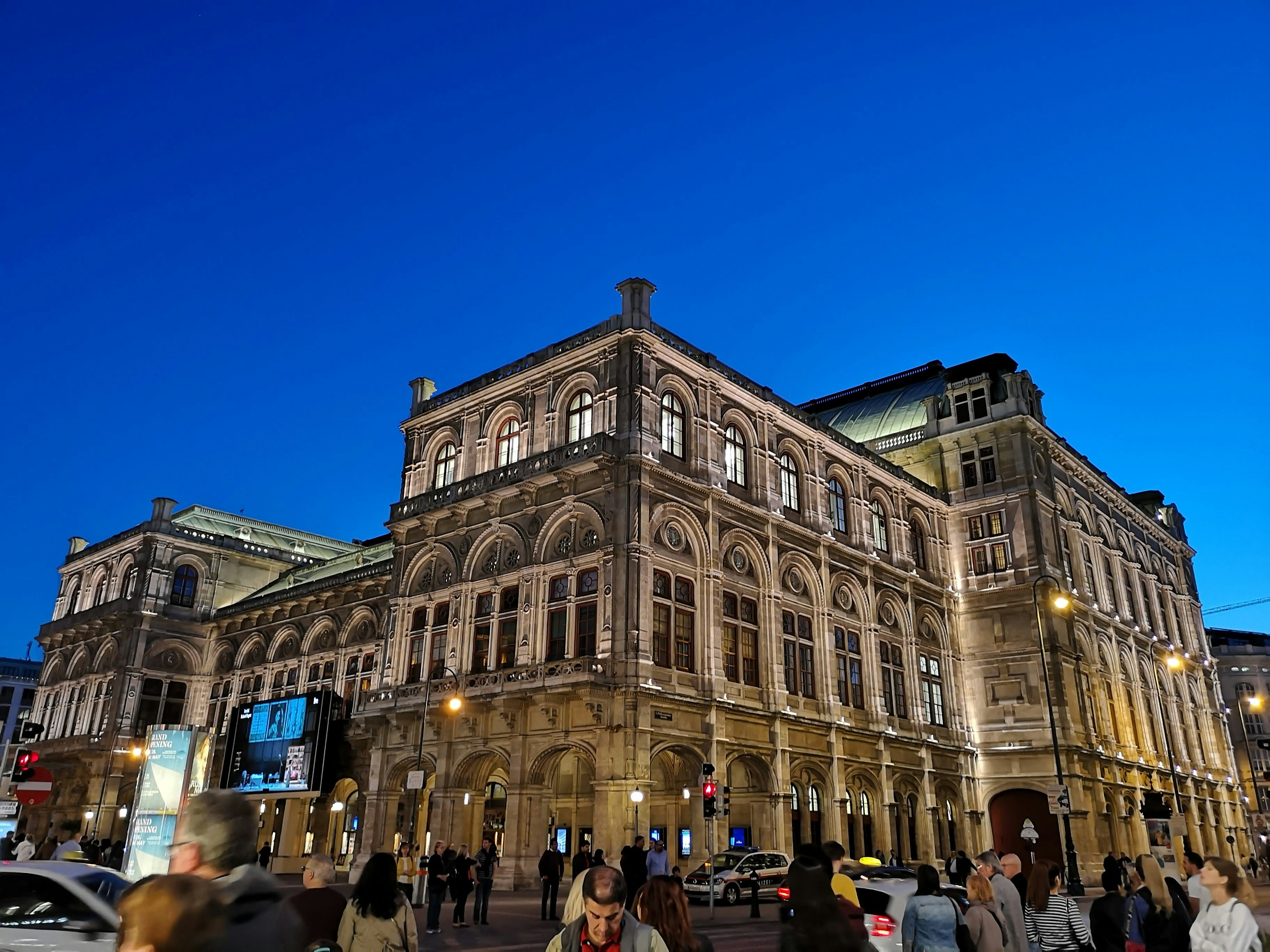 people walking near brown concrete building during daytime