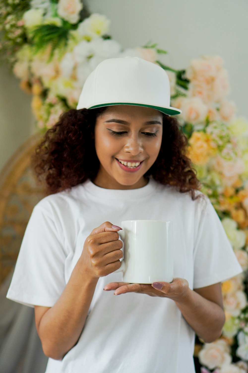 smiling girl in white crew neck t-shirt wearing white hat