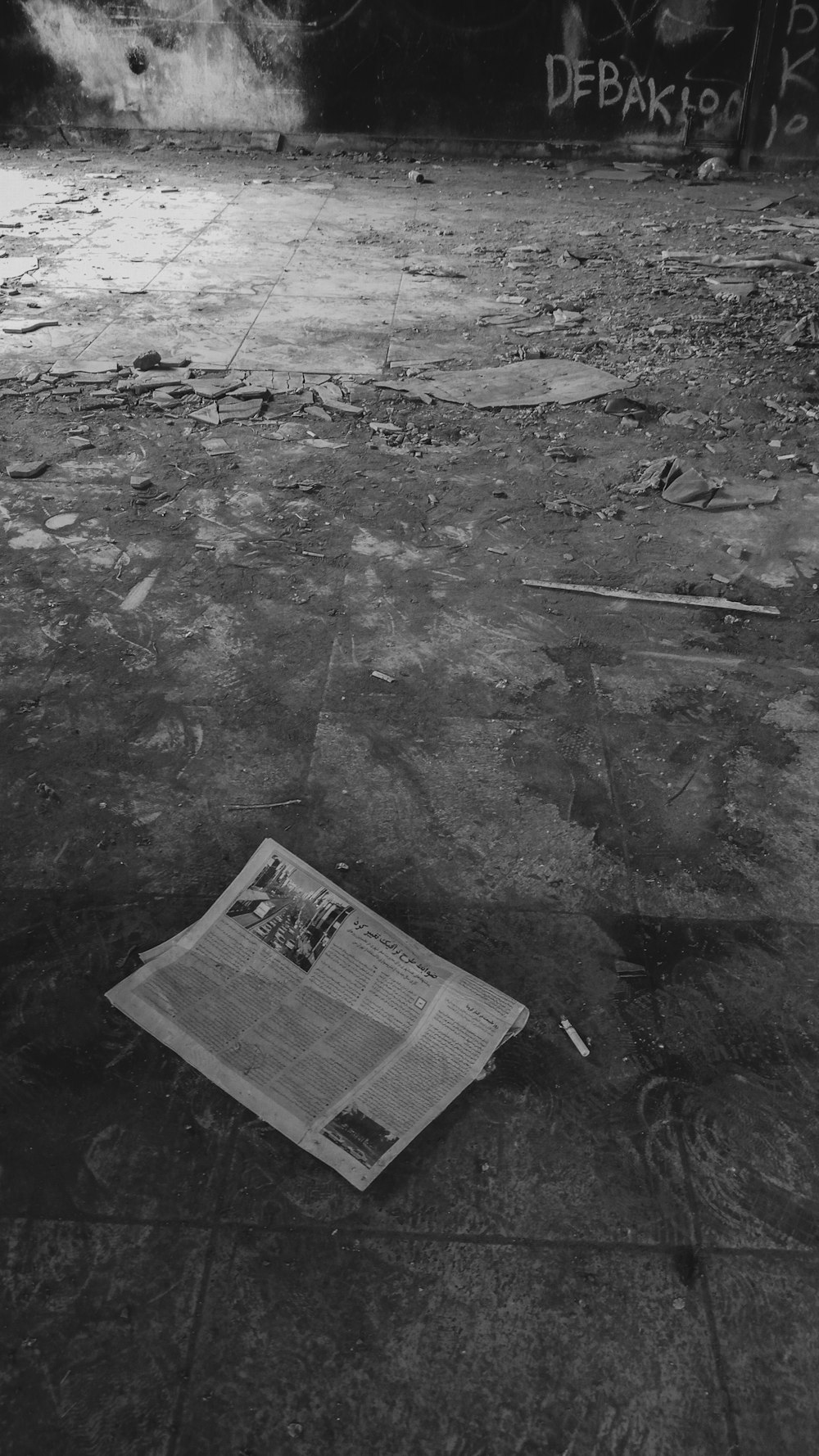 newspaper on gray concrete floor