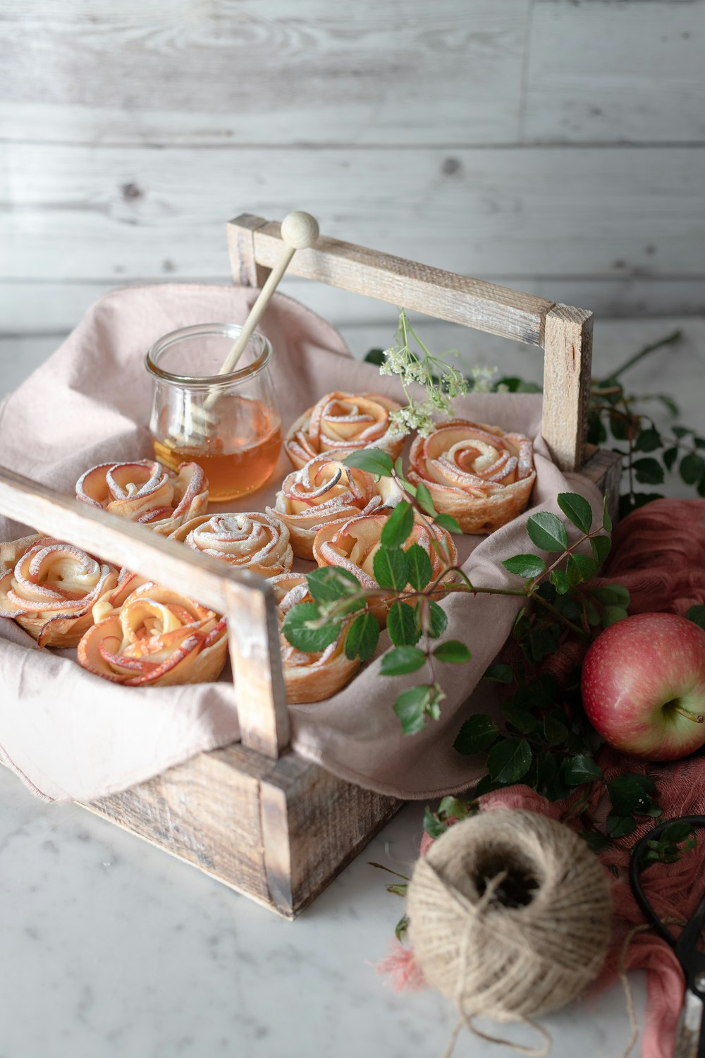 red apples on brown wooden tray