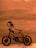 A small, decorative metal bicycle with a wooden seat is positioned against a smooth, wooden background. The bicycle features two cylindrical handles and a classic design with visible pedal gears.