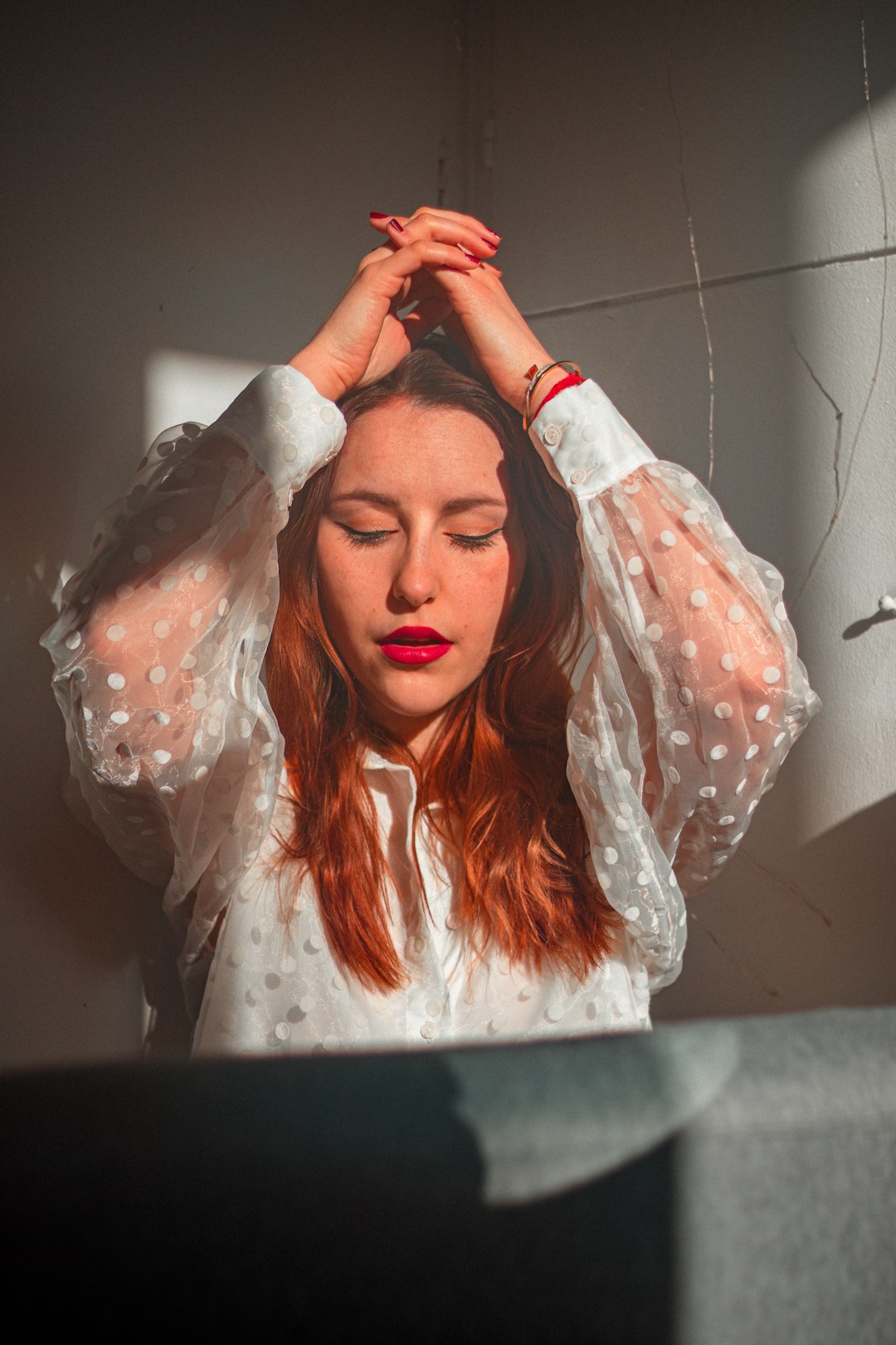 woman in white long sleeve shirt