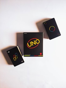 black and yellow smartphone on white table