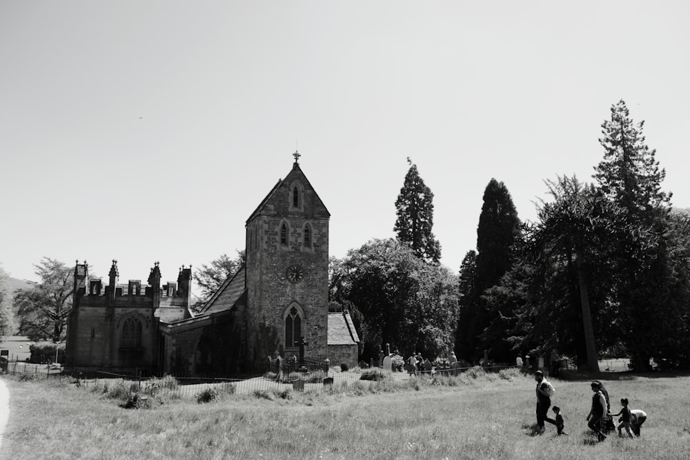 gray concrete church near green grass field during daytime