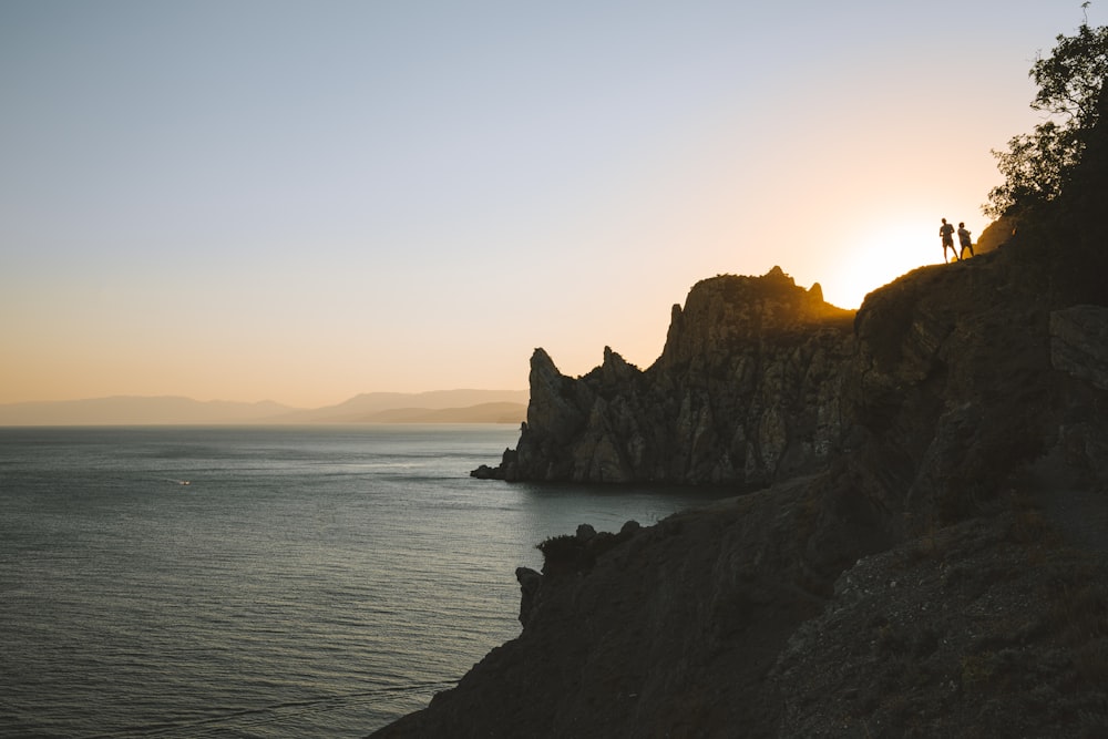 brown rock formation on sea during daytime