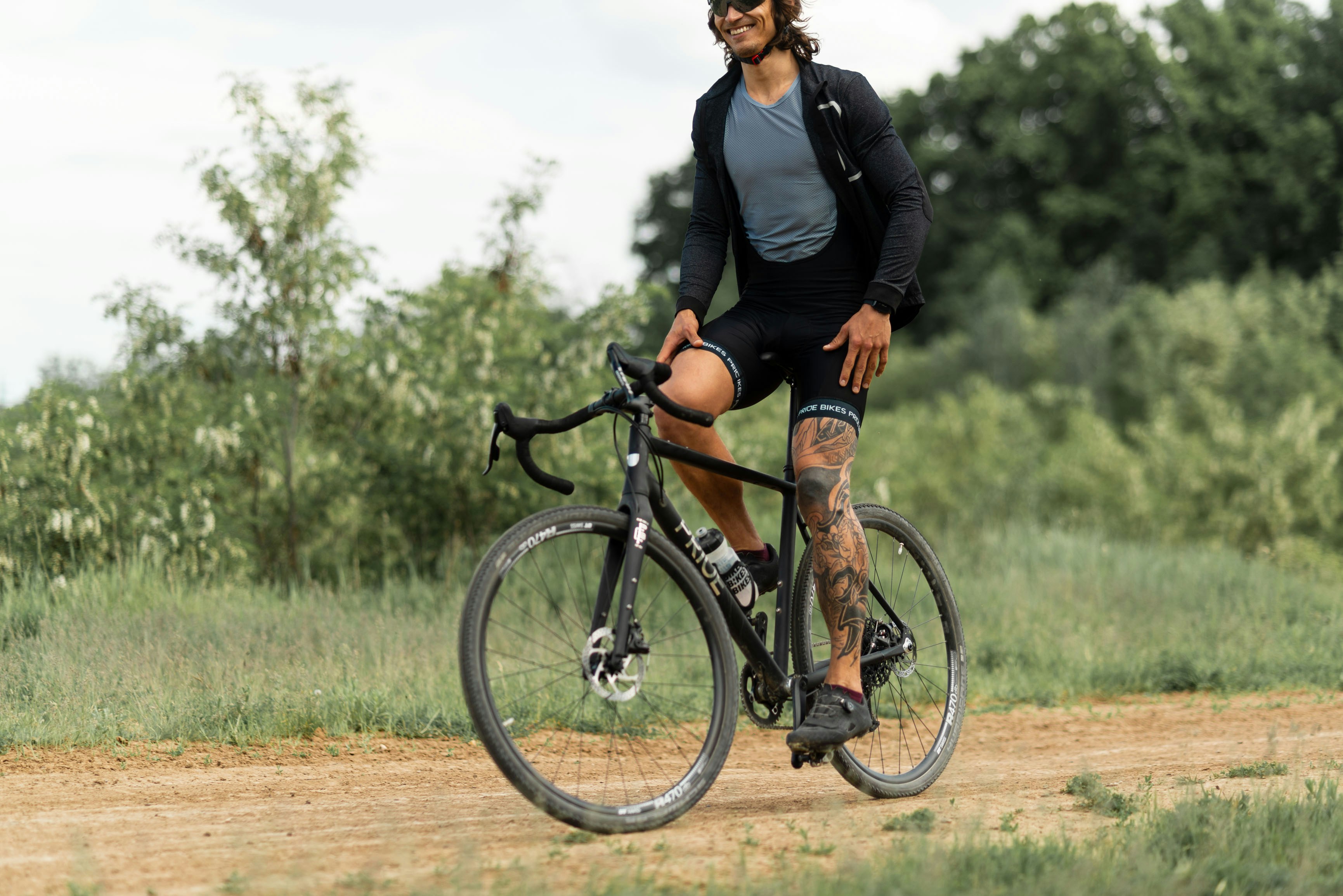 woman in black jacket riding on bicycle during daytime