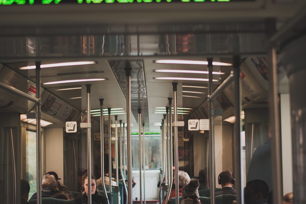 people sitting on train seat