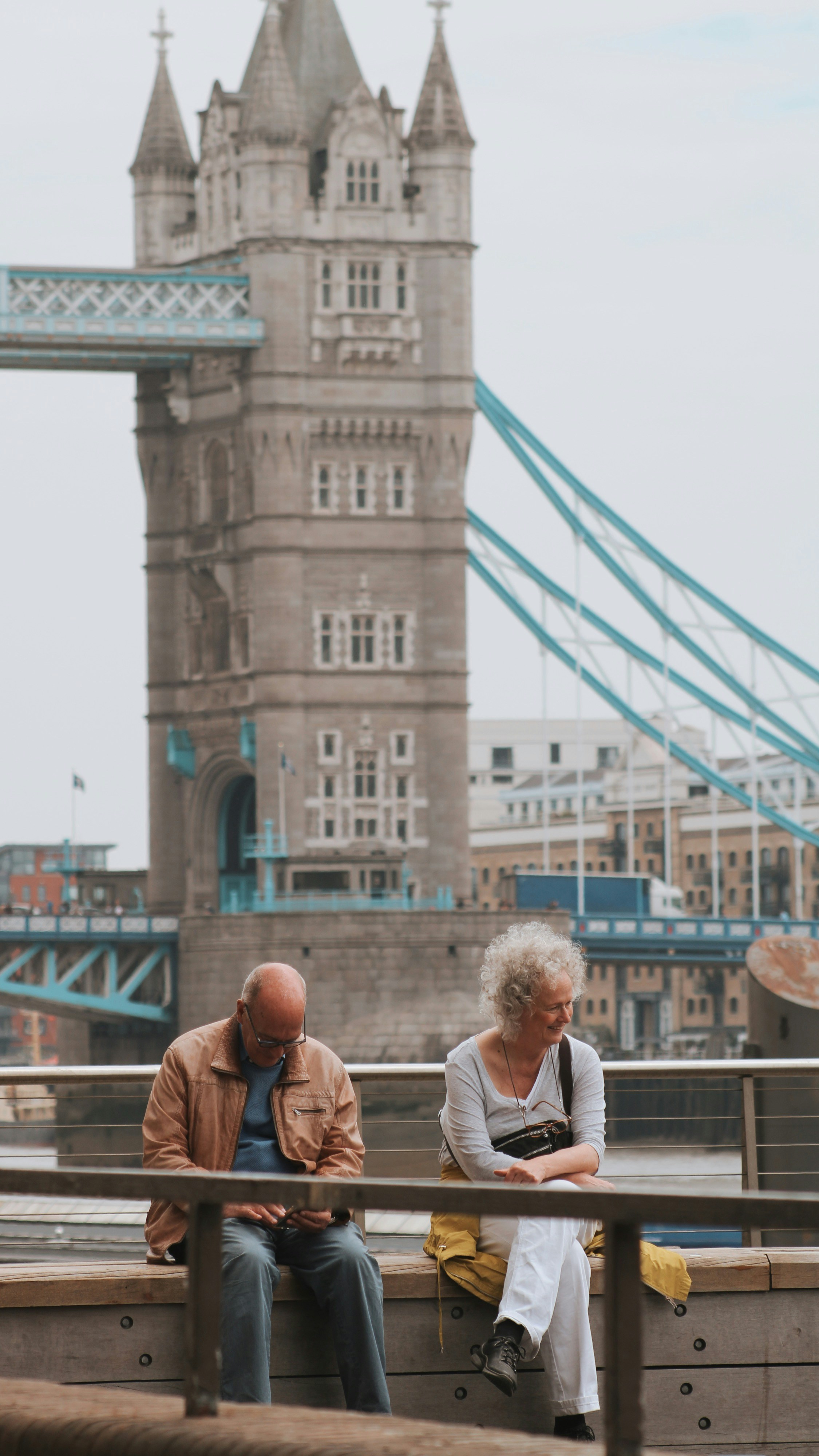 people standing near bridge during daytime