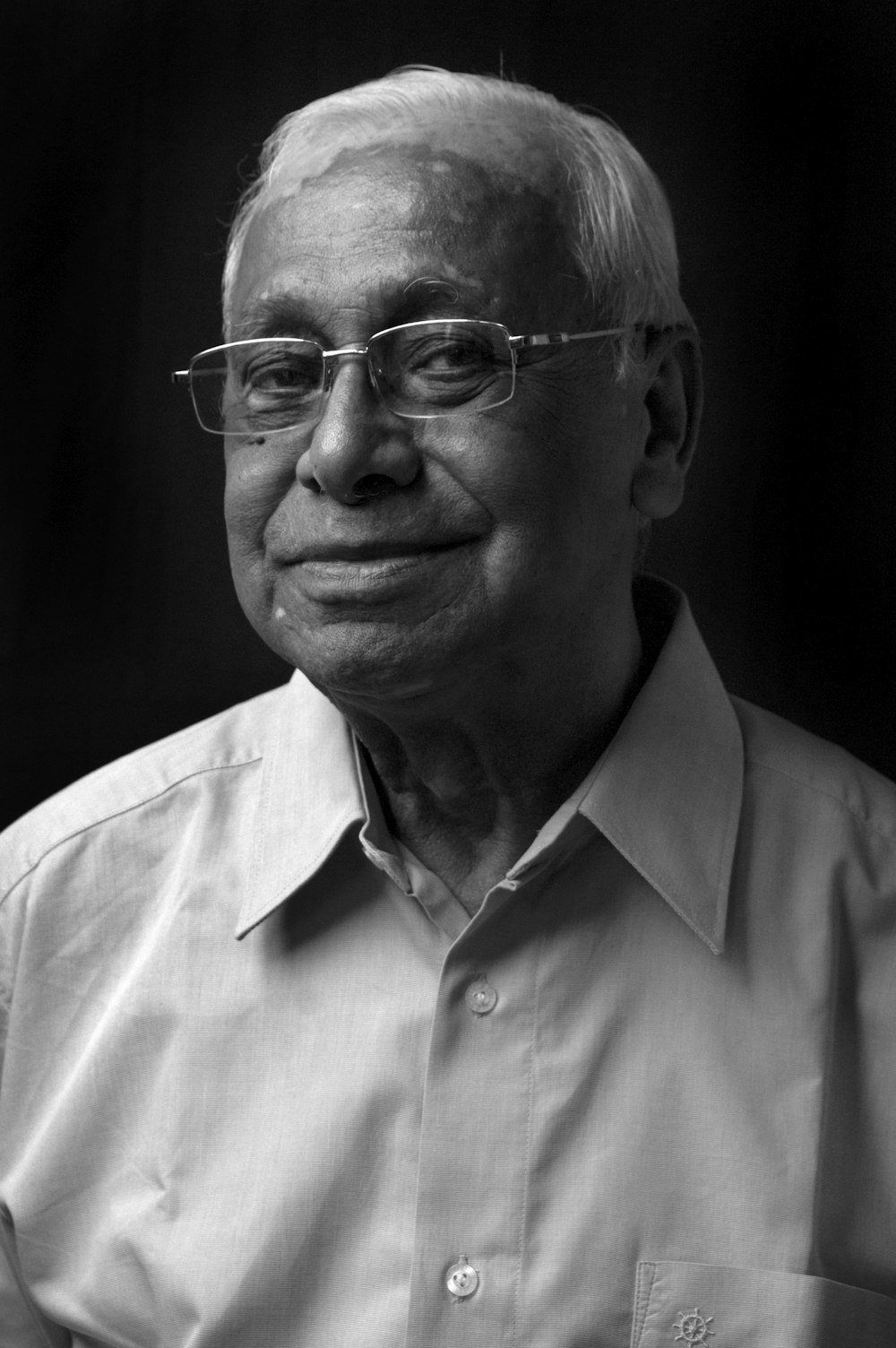 man in white button up shirt wearing eyeglasses