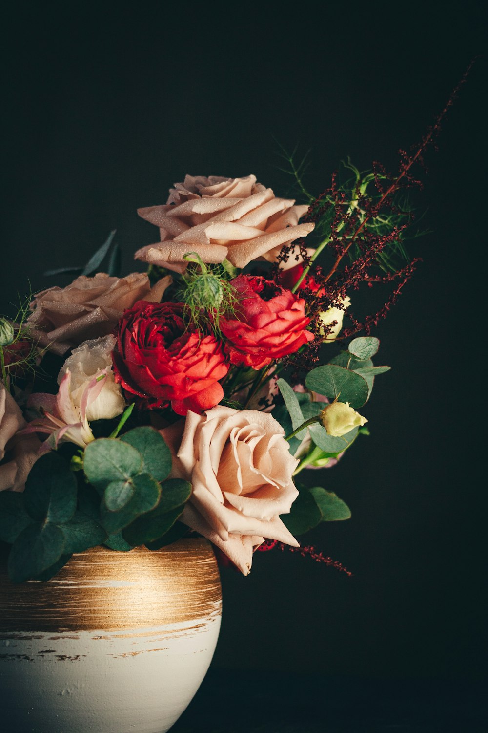 pink and white roses on brown wooden basket