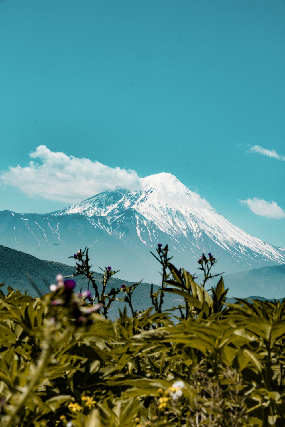 snow covered mountain under blue sky during daytime