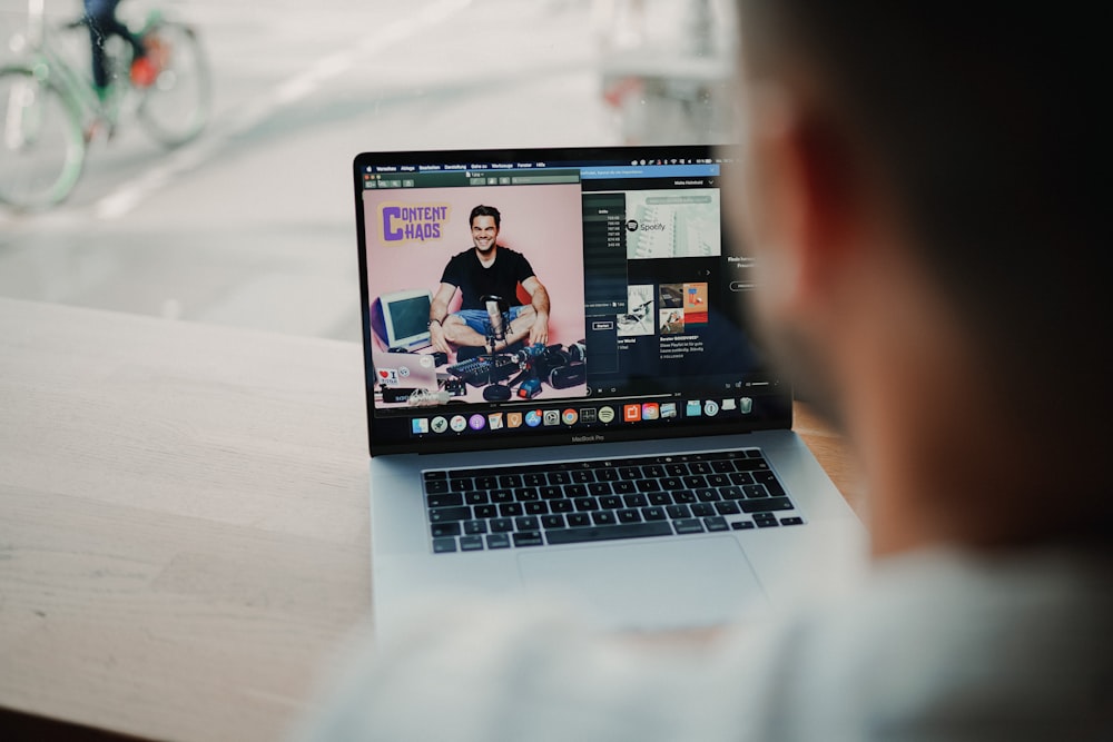 macbook pro on white table