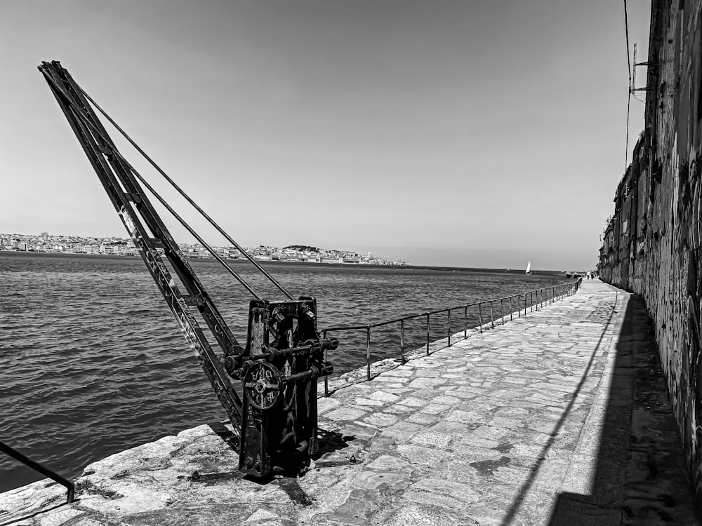 grayscale photo of a ship on a sea