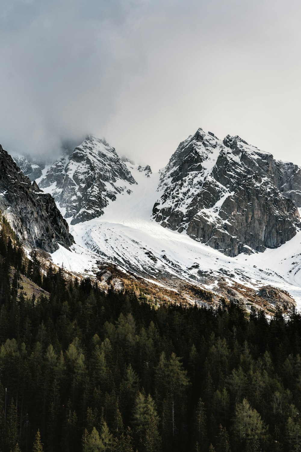 snow covered mountain during daytime