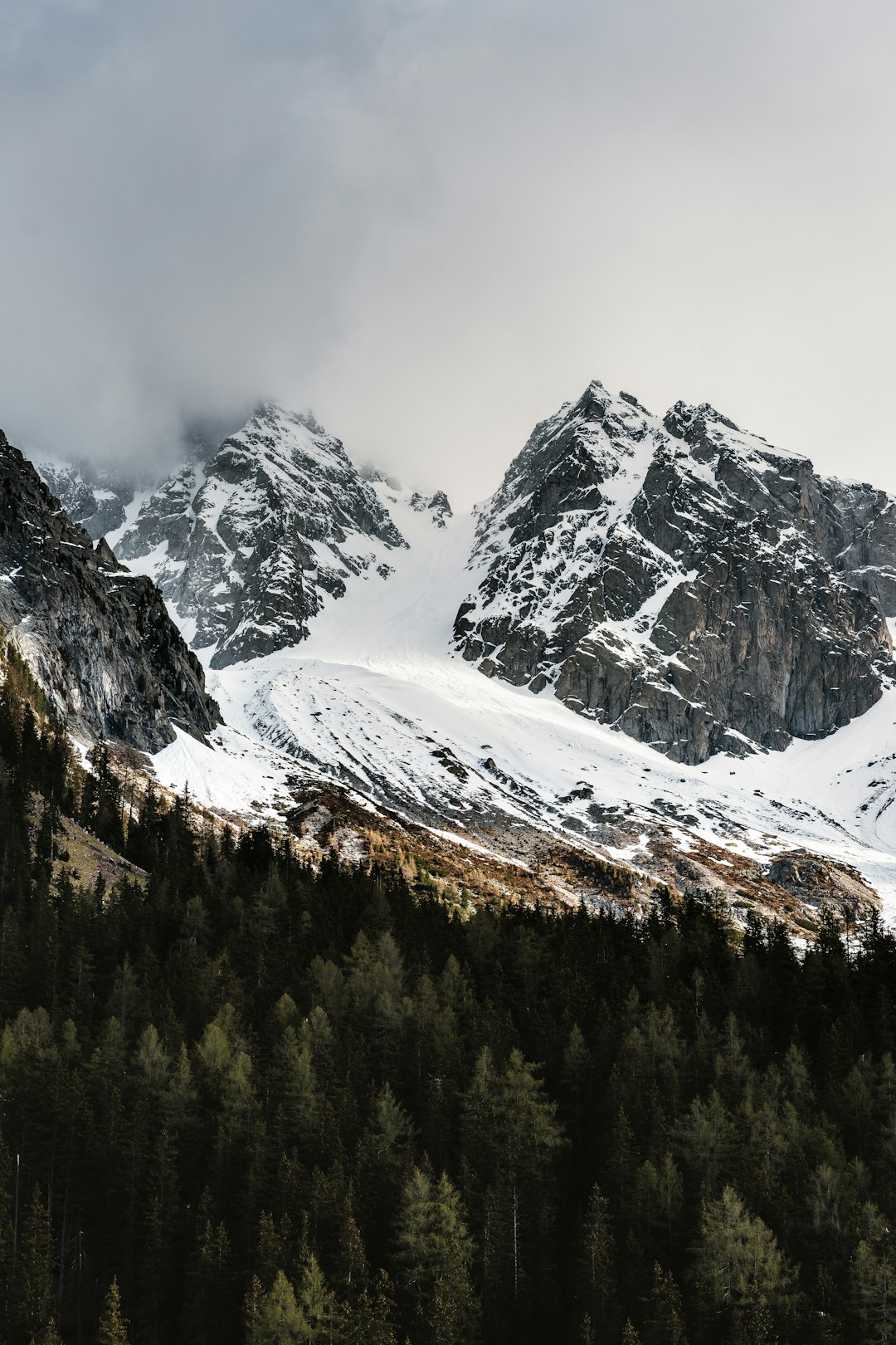 snow covered mountain during daytime