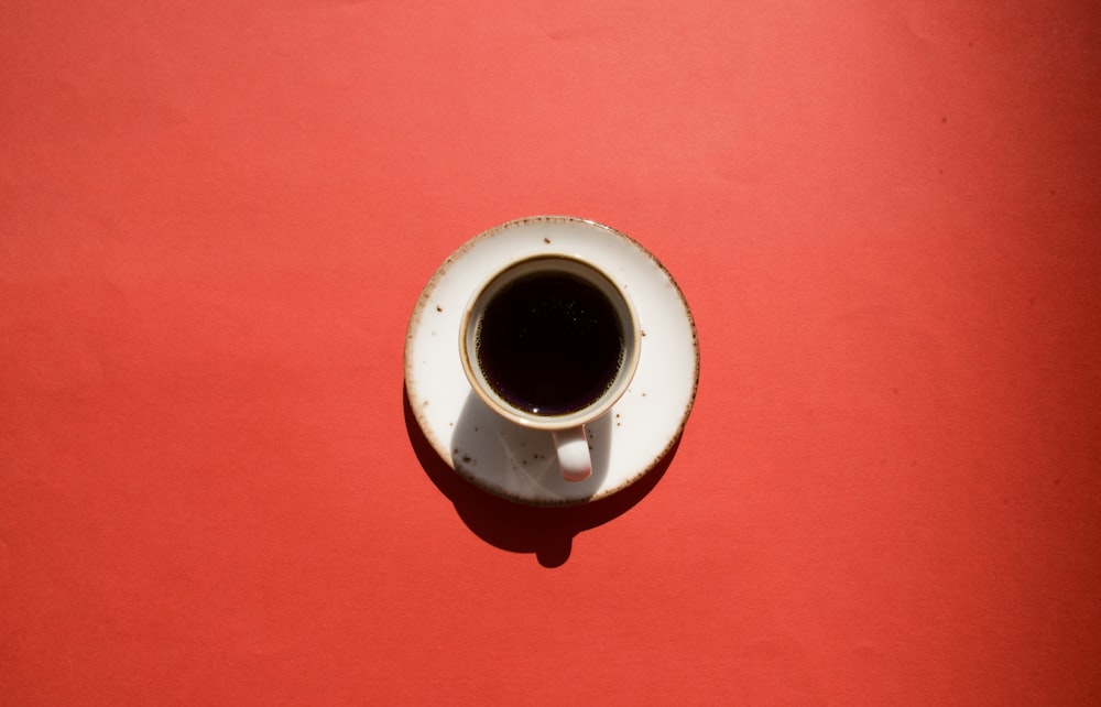 white ceramic mug on saucer