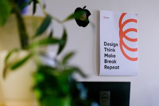 white and orange card on green plant