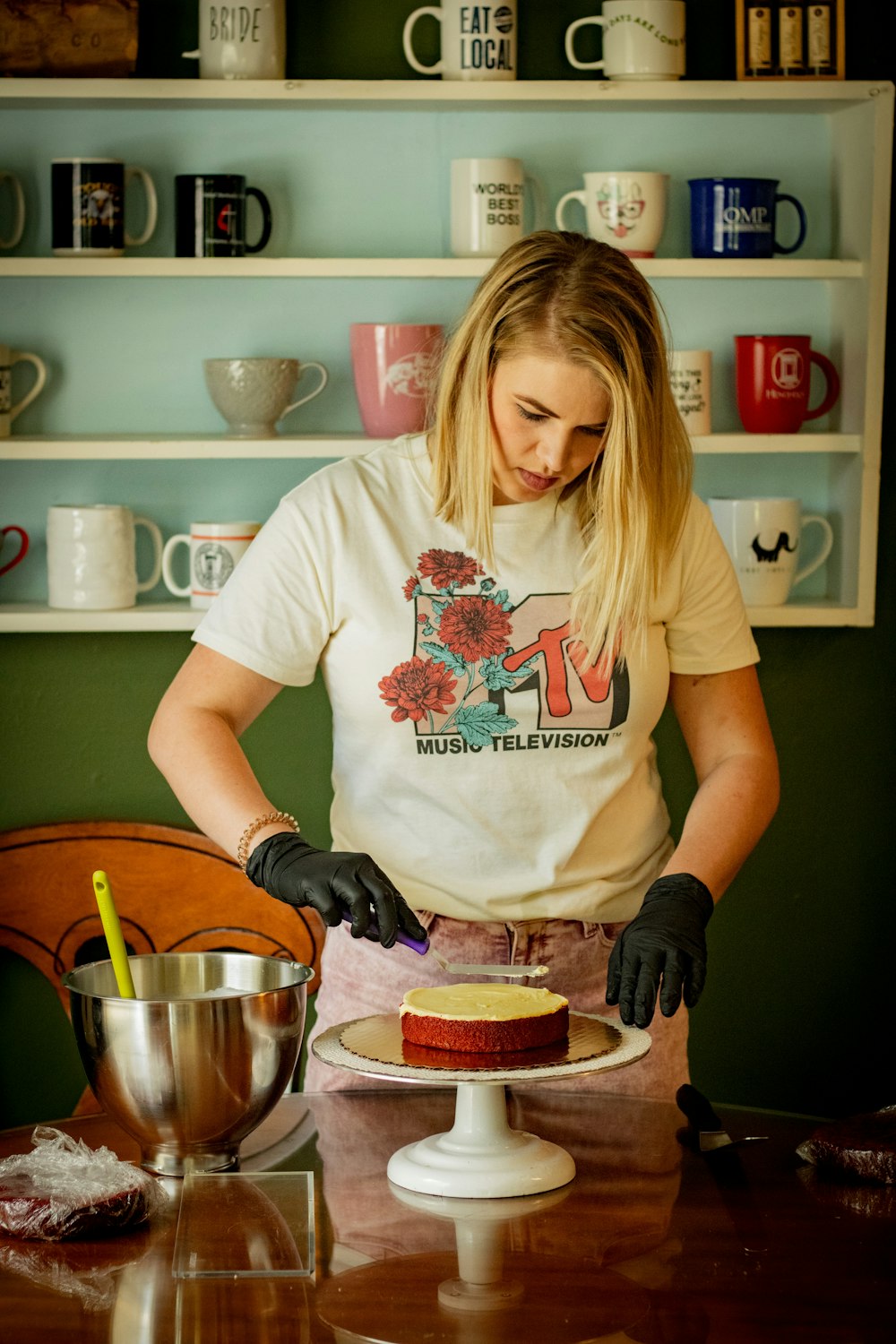 woman in white crew neck t-shirt holding stainless steel bowl